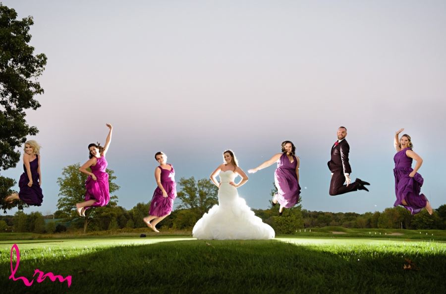 bridesmaids jumping with bride