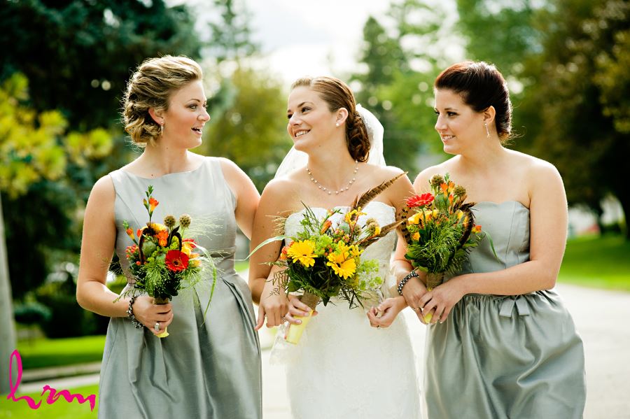 bride outside in ontario with wild flower bouquet