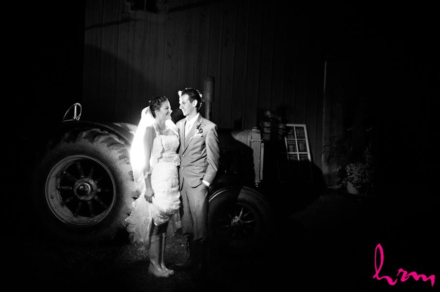 bridge and groom night time with vintage john deere tractor
