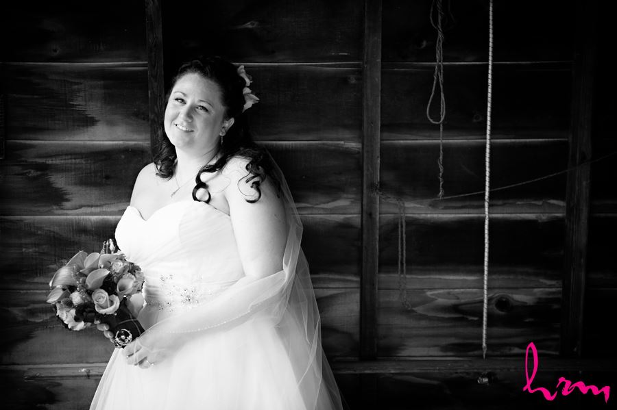 portrait of bride before ceremony against wood