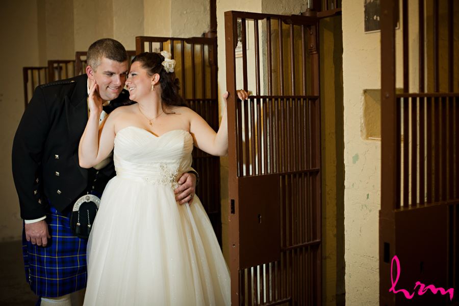 bride and groom in the old jail cell at the old court house