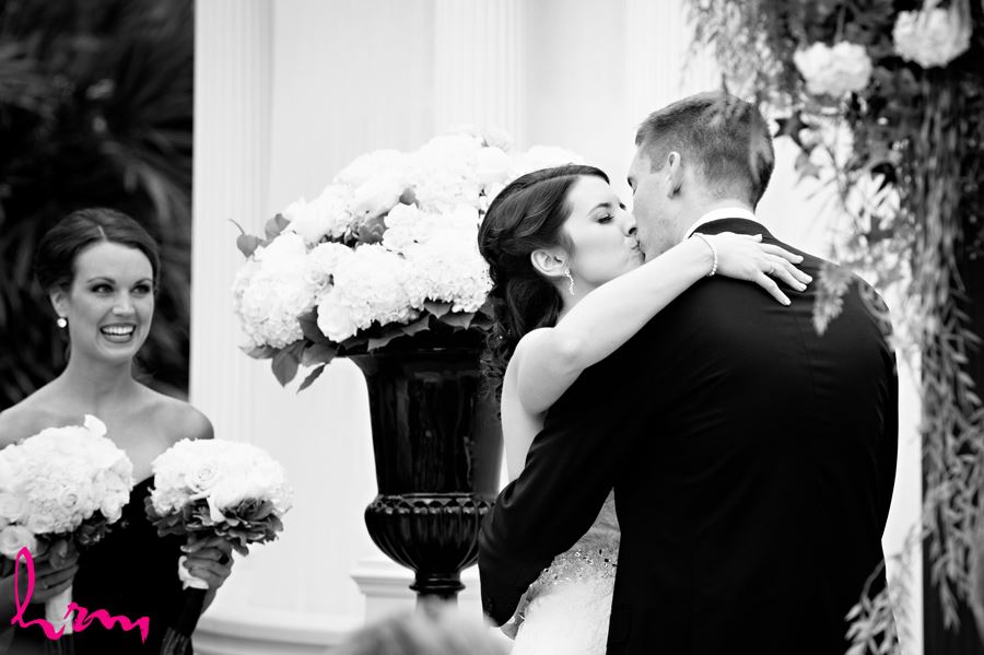 bride and groom first kiss at ceremony in the lamplighter inn