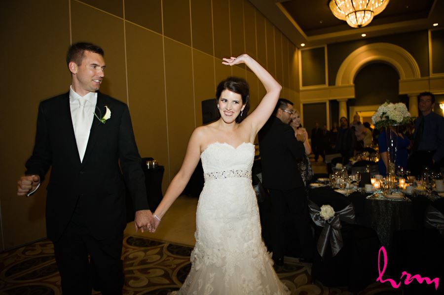 bride and groom enter reception room