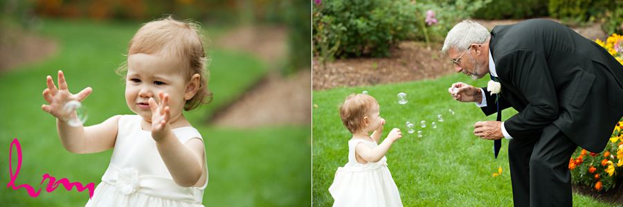 grandparent playing with grandchild with bubbles at wedding