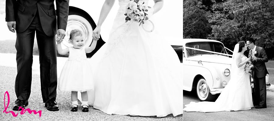 flower girl holding hands with bride and groom