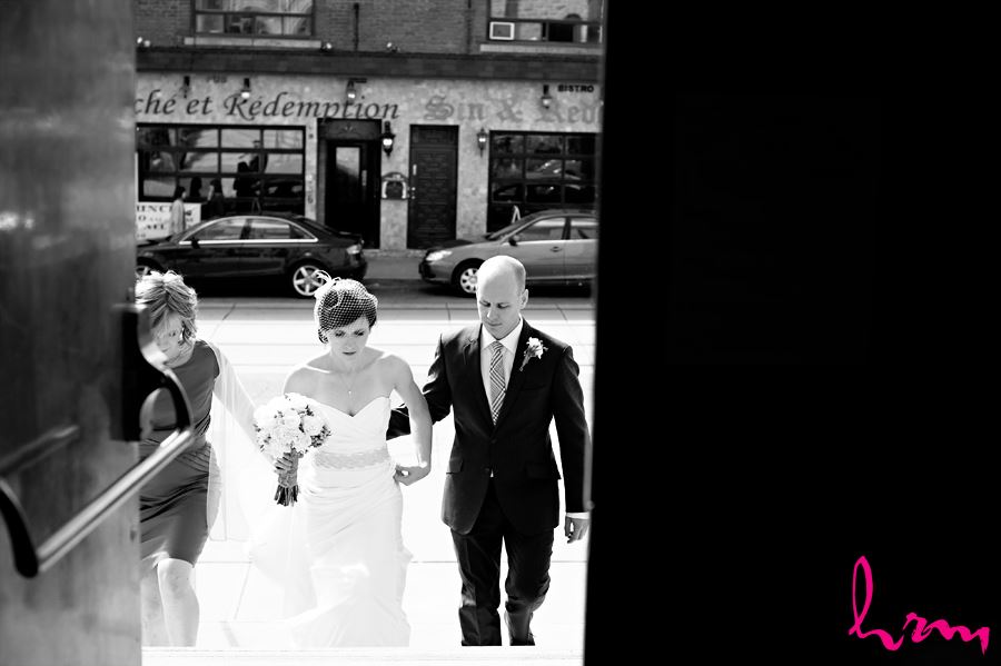 black and white bride and groom walking inside