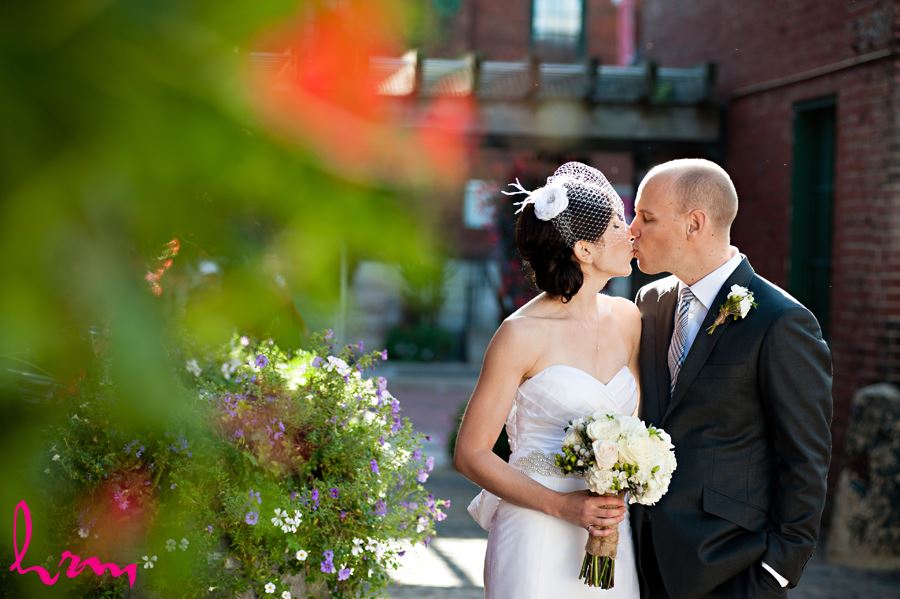 bride and groom kissing in the distillery district