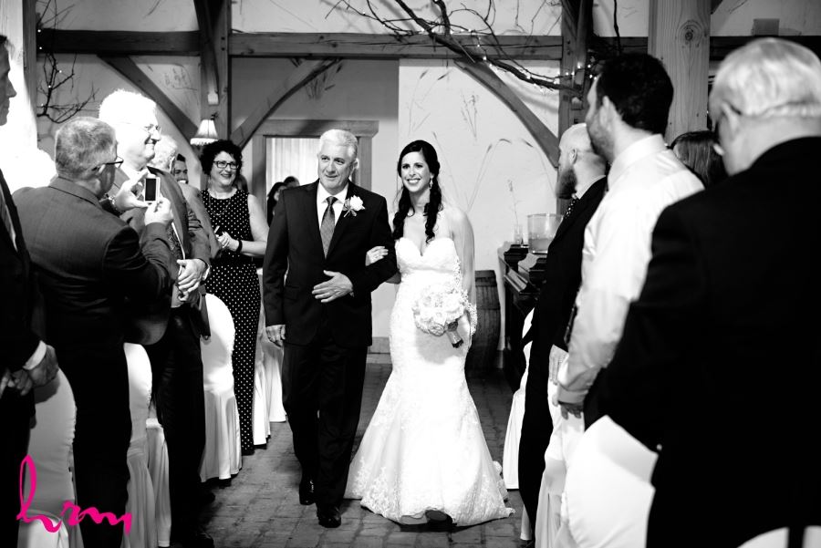 bride and father walking down aisle 