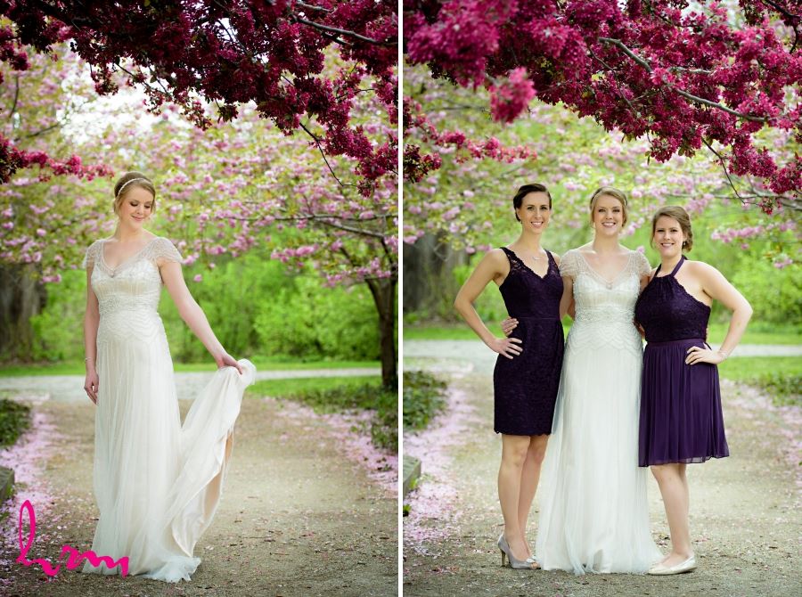 bride and bridesmaids with pink blossoms on tree