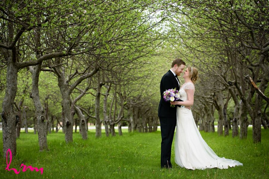 bride and groom surrounded by trees