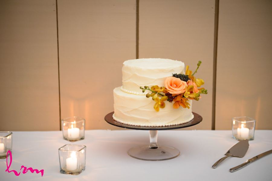 simple elegant two tier wedding cake with fall flowers