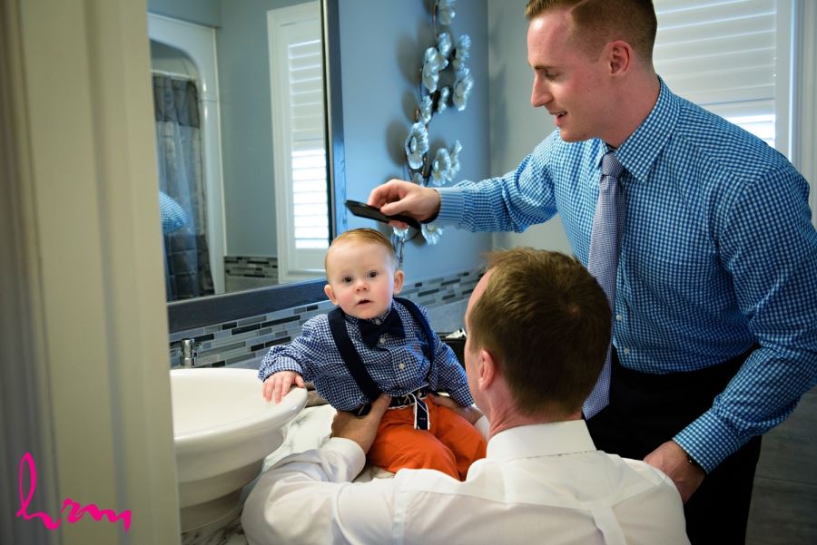 Groomsmen getting ready with baby