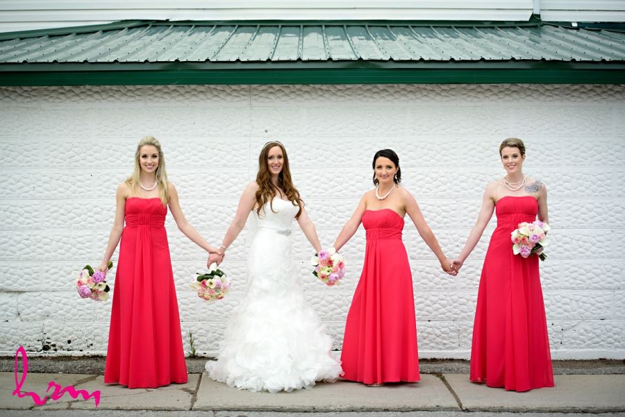 bride with bridesmaids bright red dresses