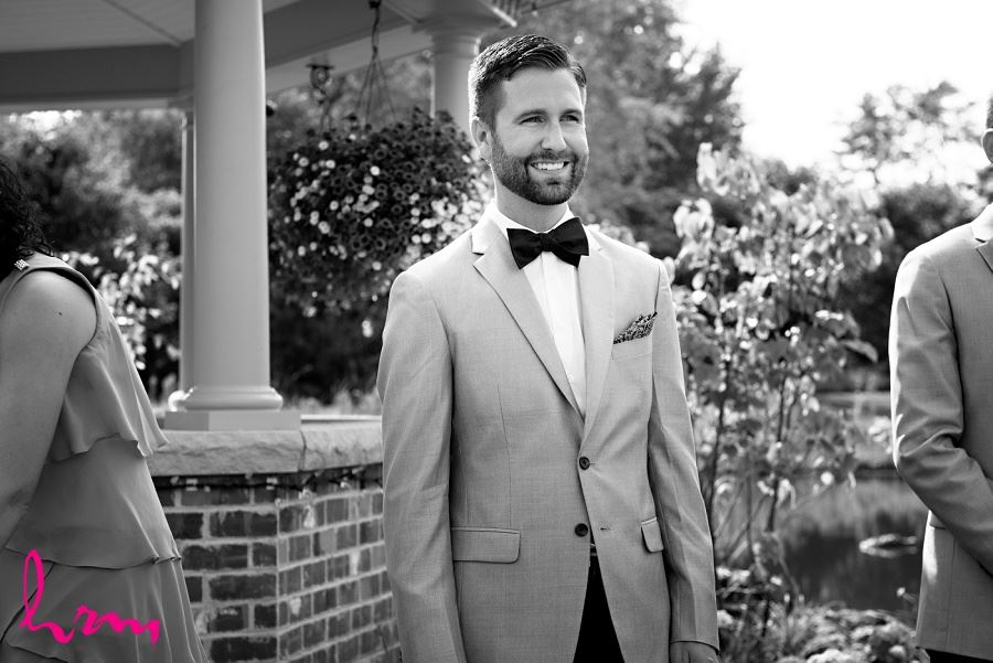 Photo of groom waiting for bride taken by London Ontario Wedding Photographer