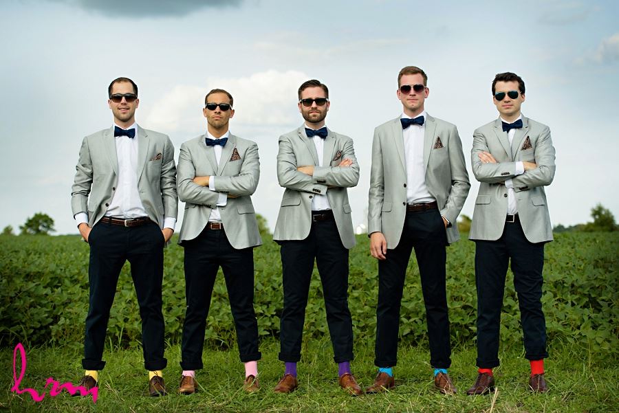Photo of groomsmen in colourful socks by London Ontario Wedding Photographer