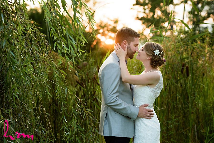 Photo of bride and groom with setting sun by HRM Photography London Ontario Wedding Photographer