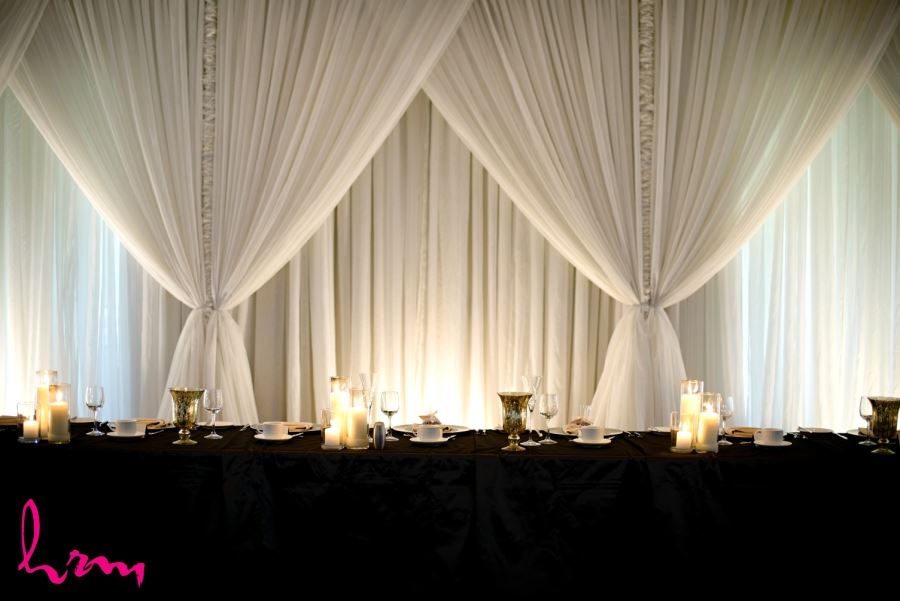 firerock golf club simple elegant head table with drapery candles silk black table cloth