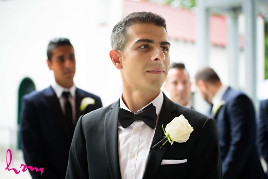 Groom with white rose boutineer