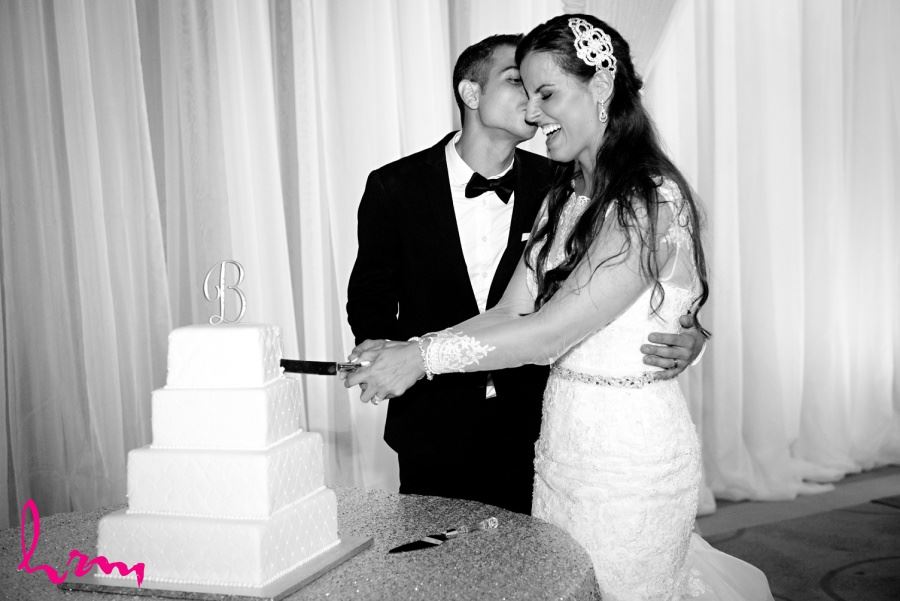 wedding reception cake cutting in black and white