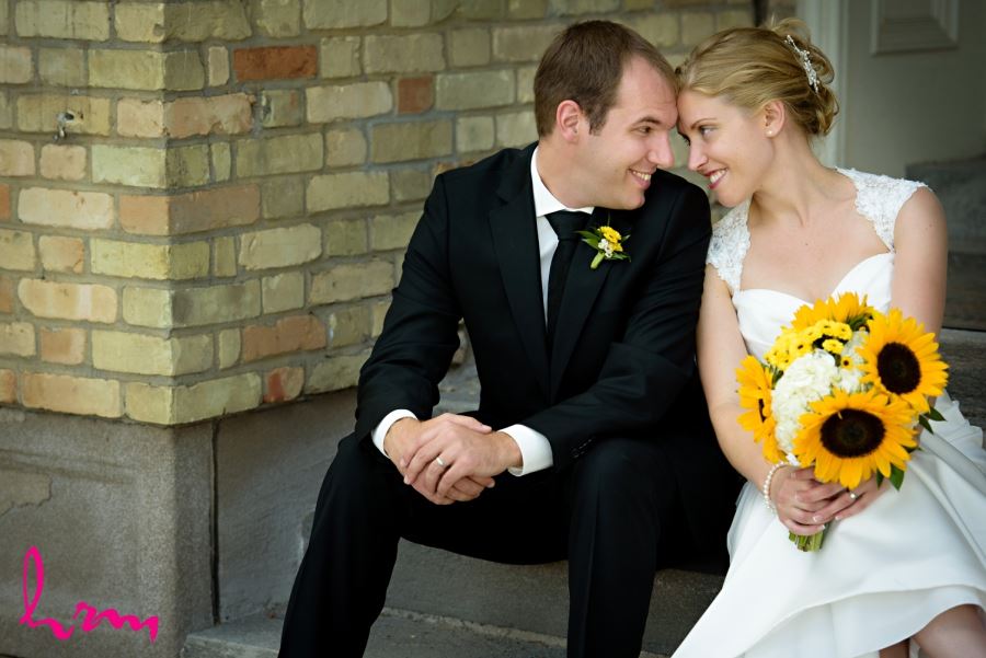bride and groom with yellow bouquet and boutineer