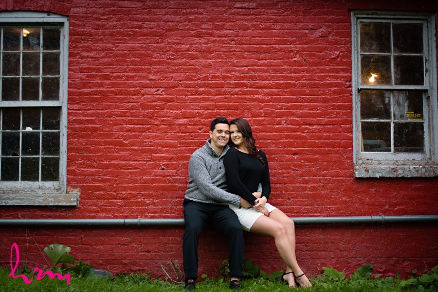 engagement session red painted brick wall