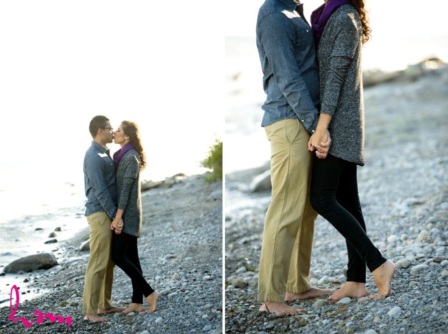 engagement session photography couple kissing on rocky beach