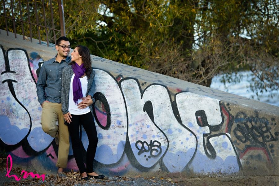engagement session in front of graffiti wall