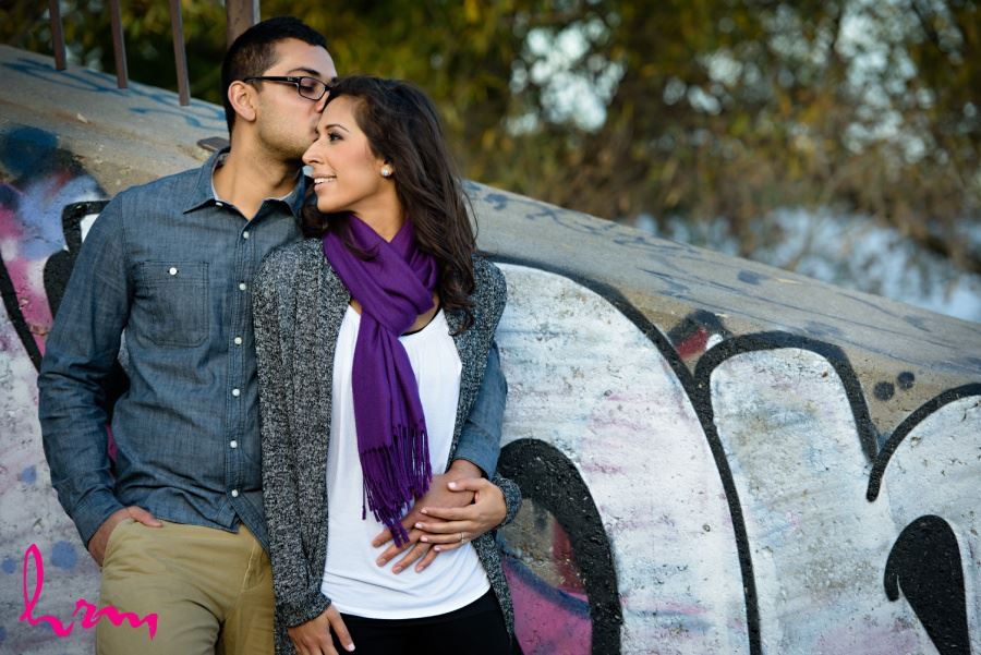 engagement session in front of graffiti wall urban