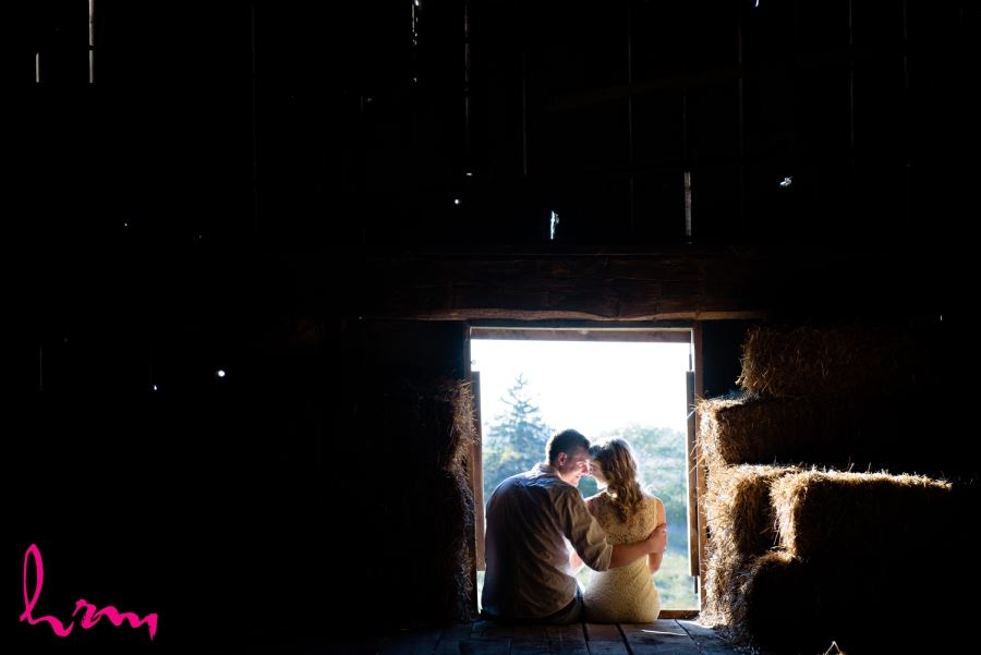 engagement session couple in barn window