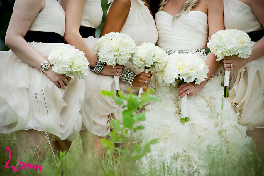 Wedding photo of bridesmaids holding bouquets 