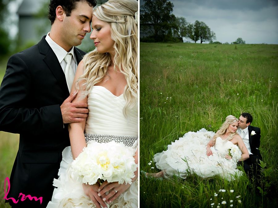 Wedding photo of bride and groom embracing in field
