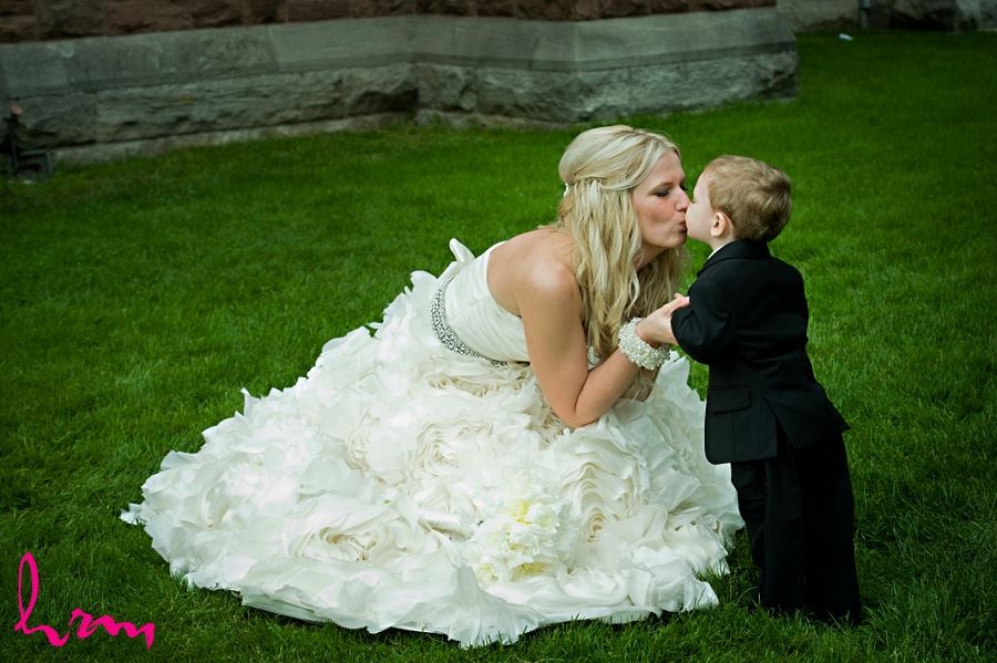 Photo of bride kissing little boy taken by London Ontario Wedding photographer