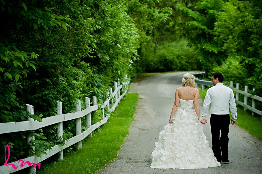 Wedding photo of Ania and Ken walking down road