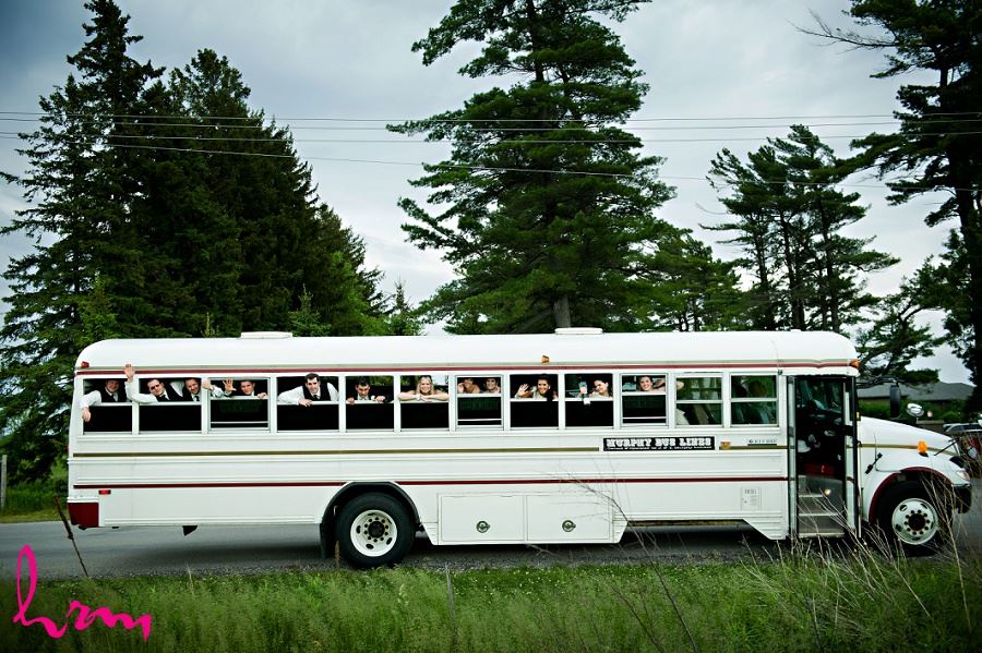 Wedding photo of bridal party on bus