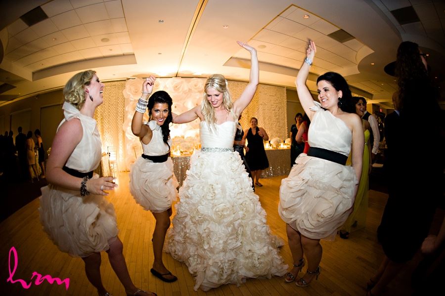 Bride and Bridesmaids dancing taken by London Ontario wedding photographer