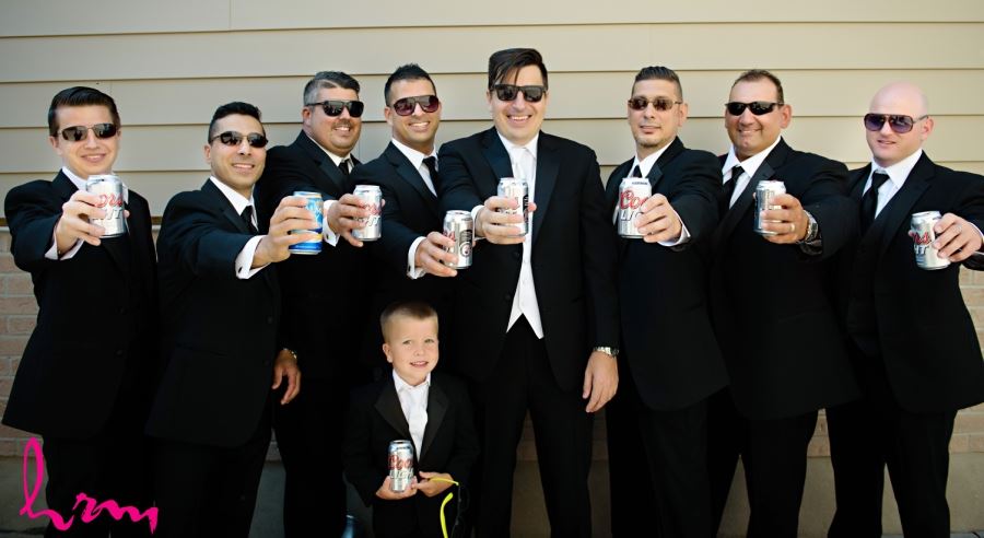 groomsmen with drinks and sunglasses