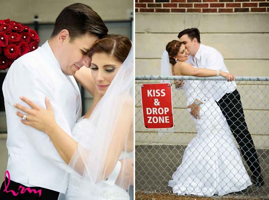 bride and groom with kiss & drop zone sign