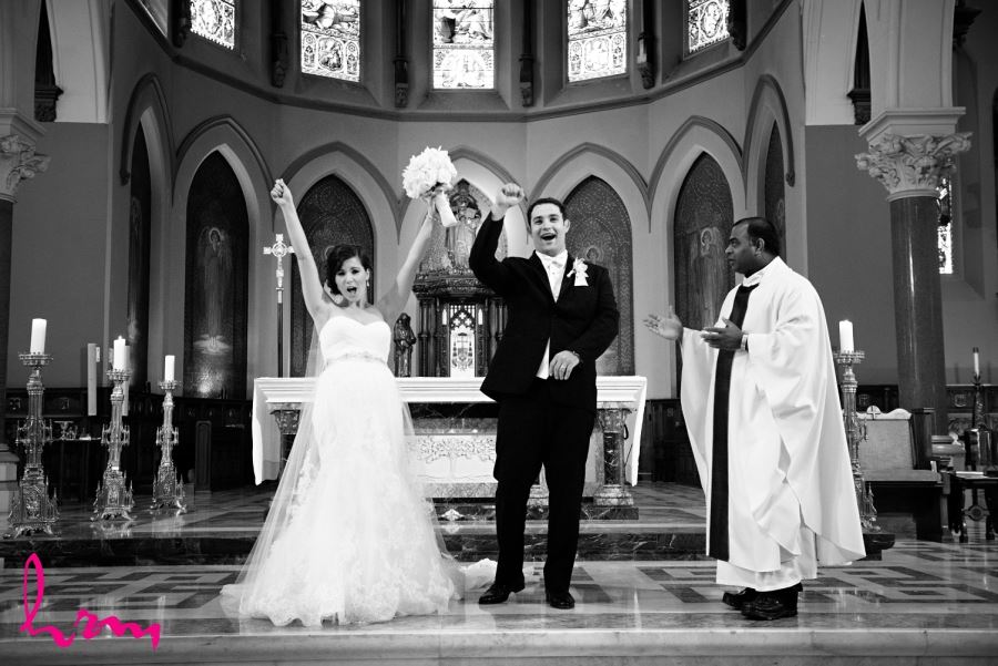 bride and groom pronounced husband and wife at alter