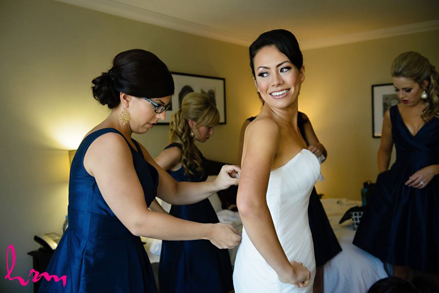 Geneviève getting in to dress London ON Wedding Photography