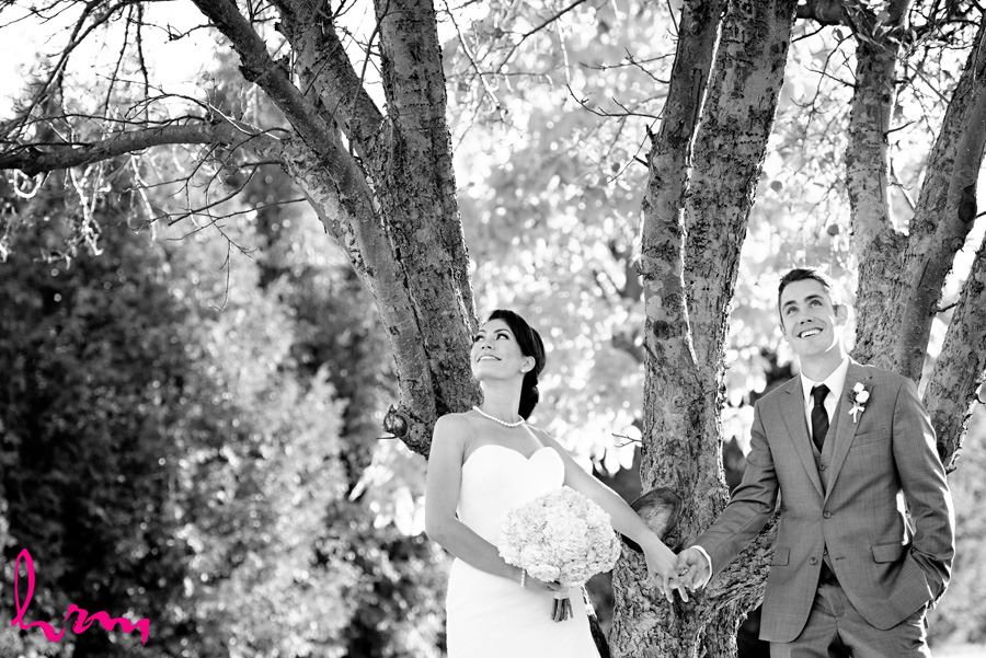 Black and white Geneviève + Will in orchard Heeman Greenhouses London ON Wedding HRM Photography