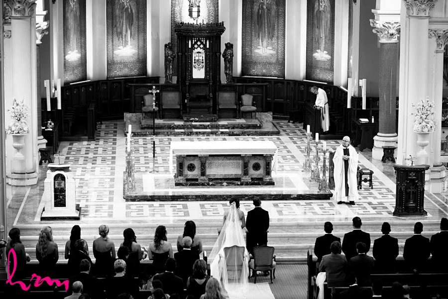 bride and groom at grand alter in london ontario wedding