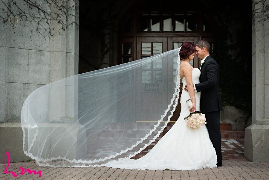 bride with long lace embellished wedding veil
