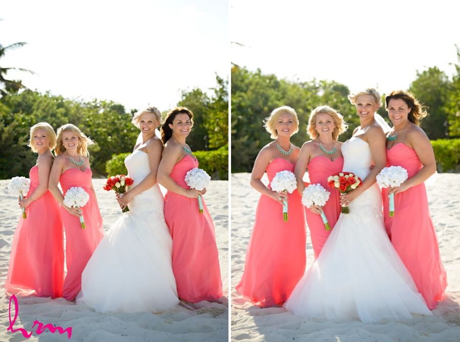 Bridesmaids in coral dresses with white bouquets