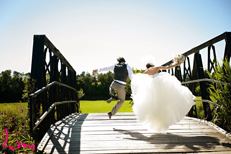 Leigh + Pete jumping for joy Purple Hill Country Farms London ON Wedding HRM Photography