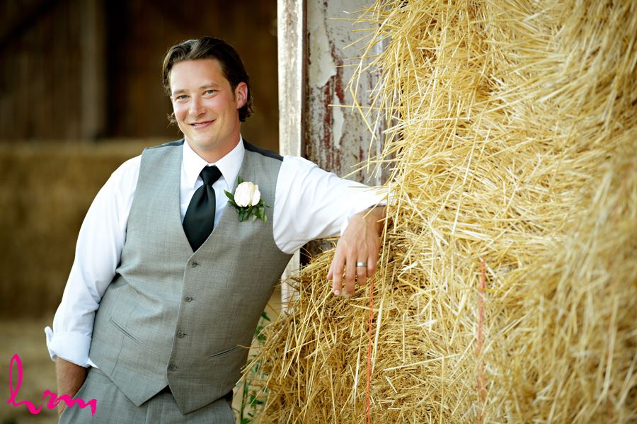 Pete by hay bales Purple Hill Country Farms London ON Wedding Photography