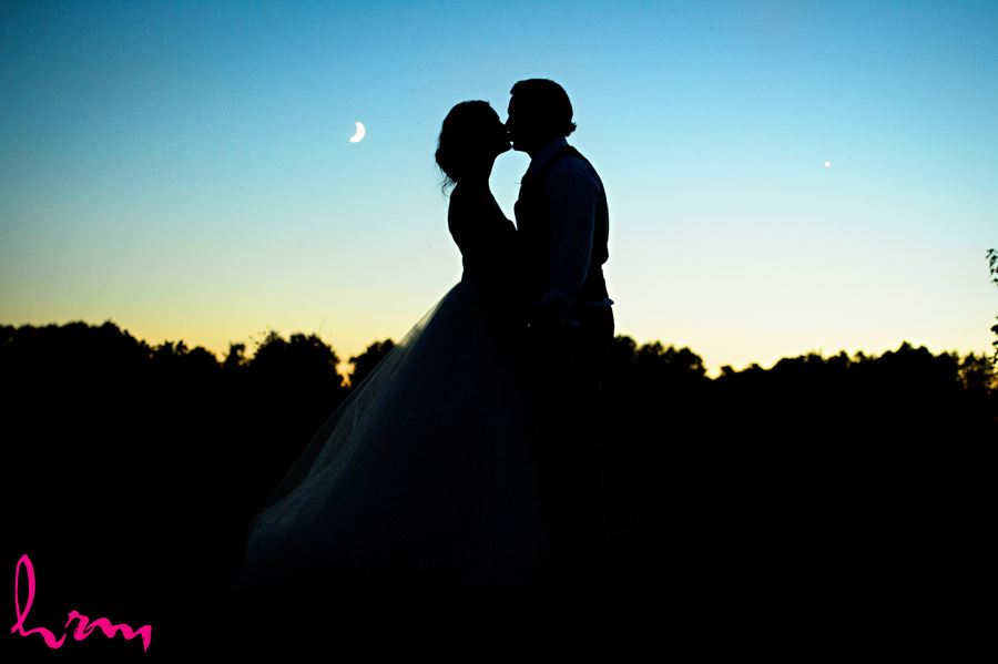 Leigh and Pete kiss in moonlight Purple Hill Country Farms London ON Wedding Photography