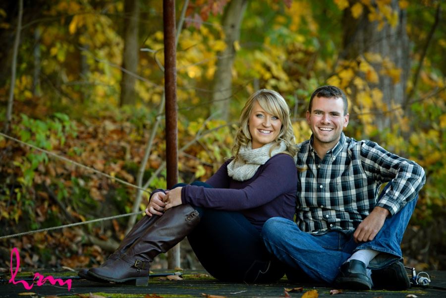 Fall engagement session in wooded area fishing