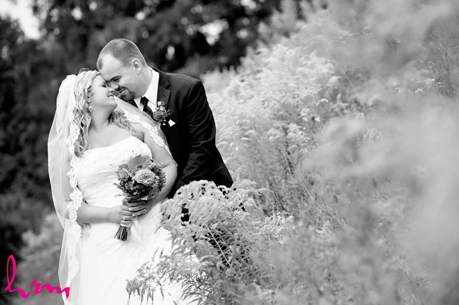 Black and white photo of Mallory and Will in field St. Thomas ON Wedding Photography