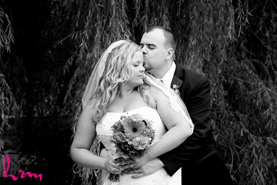 Black and white photo of Mallory and Will in trees St. Thomas ON Wedding Photography