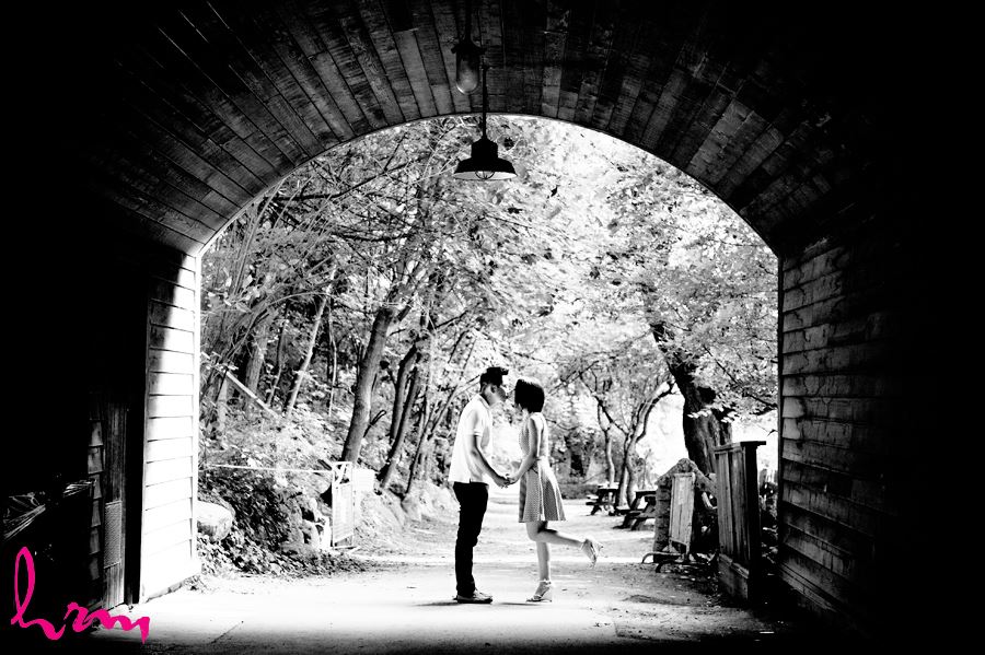 Couple kissing under bridge Riverdale Farm